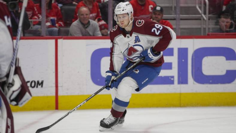 Mar 18, 2023; Detroit, Michigan, USA; Colorado Avalanche center Nathan MacKinnon (29) handles the puck during the second period at Little Caesars Arena. Mandatory Credit: Brian Bradshaw Sevald-USA TODAY Sports