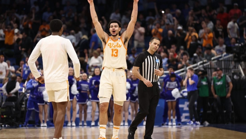 Mar 18, 2023; Orlando, FL, USA;  Tennessee Volunteers forward Olivier Nkamhoua (13) celebrates after defeating the Duke Blue Devils in the second round of the 2023 NCAA Tournament at Legacy Arena. Mandatory Credit: Matt Pendleton-USA TODAY Sports