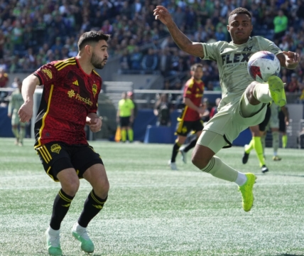 Mar 18, 2023; Seattle, Washington, USA; Seattle Sounders midfielder Alex Roldan (16) and Los Angeles FC defender Diego Palacios (12) battle for the ball during the first half at Lumen Field. Mandatory Credit: Kirby Lee-USA TODAY Sports