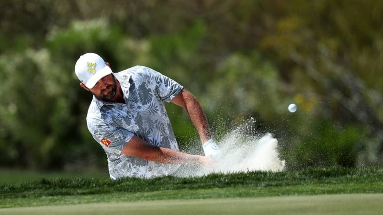 Mar 18, 2023; Tucson, Arizona, USA; Marc Leishman hits from the bunker of 9th hole during the second round of the LIV Golf event at The Gallery Golf Club. Mandatory Credit: Zachary BonDurant-USA TODAY Sports