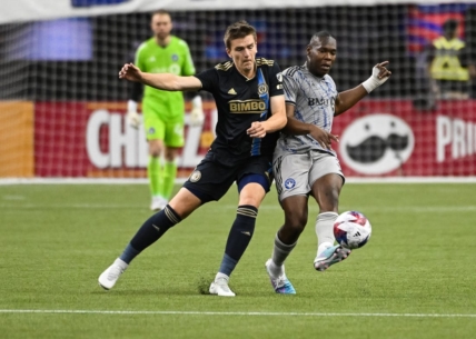 Mar 18, 2023; Montreal, Quebec, CAN; Philadelphia Union defender Jakob Glesnes (5) defends the ball against CF Montreal defender Kamal Miller (3) during first half at Olympic Stadium. Mandatory Credit: David Kirouac-USA TODAY Sports