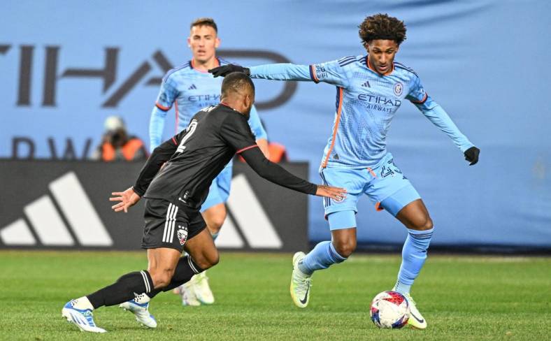 Mar 18, 2023; New York, New York, USA; New York City FC forward Talles Magno (43) dribbles the ball defended by D.C. United defender Ruan (2) during the first half at Yankee Stadium. Mandatory Credit: Mark Smith-USA TODAY Sports
