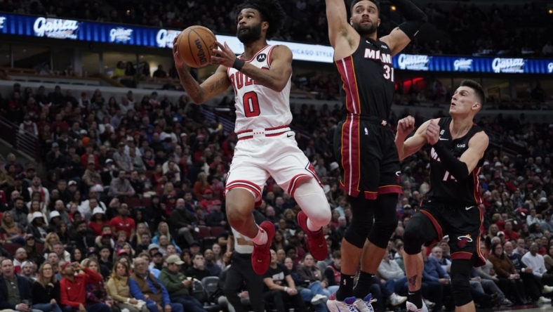 Mar 18, 2023; Chicago, Illinois, USA; Miami Heat guard Max Strus (31) defends Chicago Bulls guard Coby White (0) during the first half at United Center. Mandatory Credit: David Banks-USA TODAY Sports