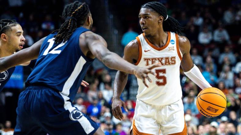 Texas guard Marcus Carr looks to drive to the basket against Penn State guard Evan Mahaffey during an NCAA men  s basketball tournament second round basketball game on Saturday, March 18, 2023, at Wells Fargo Arena, in Des Moines, Iowa.