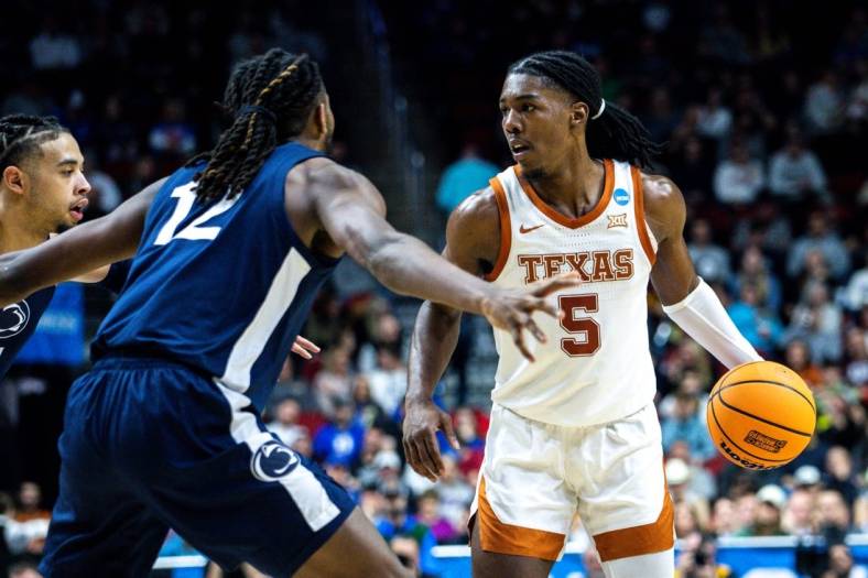 Texas guard Marcus Carr looks to drive to the basket against Penn State guard Evan Mahaffey during an NCAA men  s basketball tournament second round basketball game on Saturday, March 18, 2023, at Wells Fargo Arena, in Des Moines, Iowa.