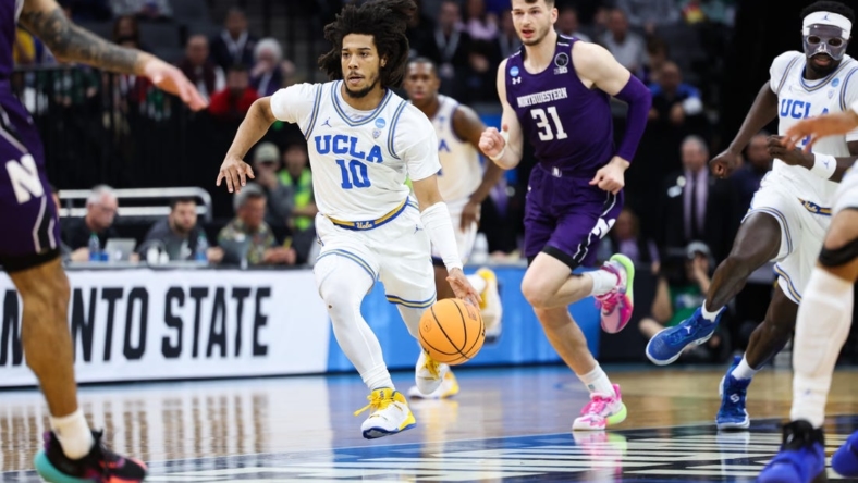 Mar 18, 2023; Sacramento, CA, USA; UCLA Bruins guard Tyger Campbell (10) dribbles down the court during the first half against the Northwestern Wildcats at Golden 1 Center. Mandatory Credit: Kelley L Cox-USA TODAY Sports