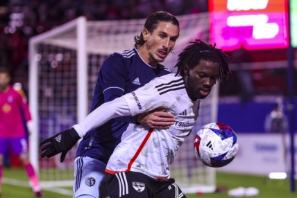Mar 18, 2023; Frisco, Texas, USA;  Sporting Kansas City defender Ben Sweat (2) and FC Dallas midfielder Ema Twumasi (22) go for the ball during the first half at Toyota Stadium. Mandatory Credit: Kevin Jairaj-USA TODAY Sports
