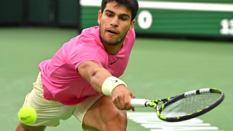 Mar 18, 2023; Indian Wells, CA, USA; Carlos Alcaraz (ESP) hits a shot in the semi final match defeating Jannik Sinner (ITA) in the BNP Paribas Open at the Indian Wells Tennis Garden. Mandatory Credit: Jayne Kamin-Oncea-USA TODAY Sports