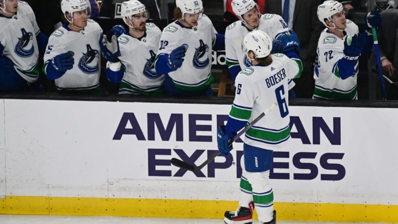 Mar 18, 2023; Los Angeles, California, USA; Vancouver Canucks right wing Brock Boeser (6) celebrates with teammates after scoring a goal against the Los Angeles Kings in a NHL game at Crypto.com Arena. Mandatory Credit: Richard Mackson-USA TODAY Sports