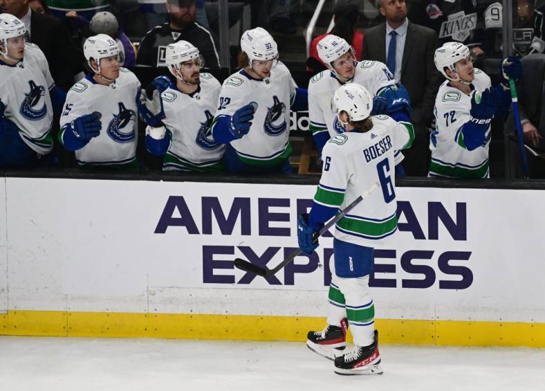 Mar 18, 2023; Los Angeles, California, USA; Vancouver Canucks right wing Brock Boeser (6) celebrates with teammates after scoring a goal against the Los Angeles Kings in a NHL game at Crypto.com Arena. Mandatory Credit: Richard Mackson-USA TODAY Sports