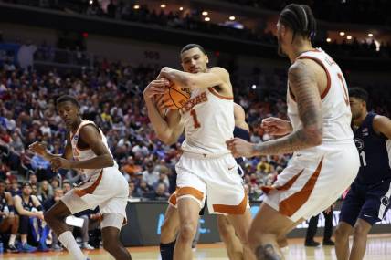 Mar 18, 2023; Des Moines, IA, USA;  Texas Longhorns forward Dylan Disu (1) grabs a rebound against the Penn State Nittany Lions during the second half at Wells Fargo Arena. Mandatory Credit: Reese Strickland-USA TODAY Sports