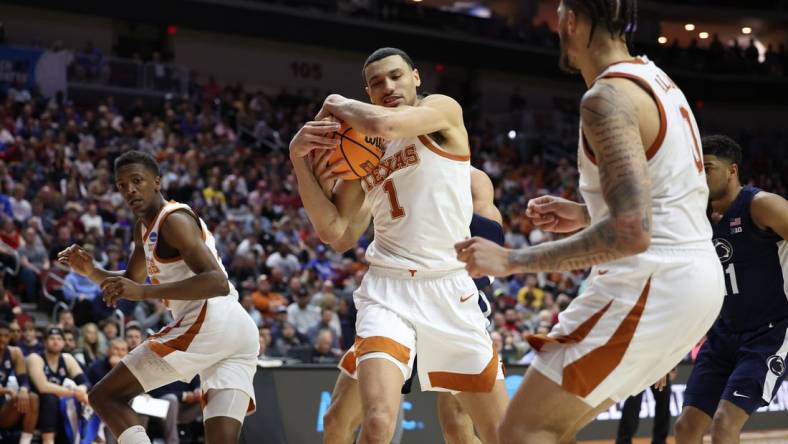 Mar 18, 2023; Des Moines, IA, USA;  Texas Longhorns forward Dylan Disu (1) grabs a rebound against the Penn State Nittany Lions during the second half at Wells Fargo Arena. Mandatory Credit: Reese Strickland-USA TODAY Sports