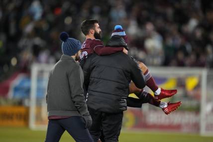 Mar 18, 2023; Commerce City, Colorado, USA; Colorado Rapids midfielder Jack Price (19) is taken off the pitch against the Minnesota United FC at Dick's Sporting Goods Park. Mandatory Credit: Ron Chenoy-USA TODAY Sports