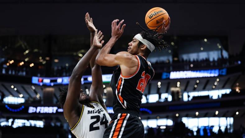 Mar 18, 2023; Sacramento, CA, USA; Princeton Tigers forward Tosan Evbuomwan (20) attempts a pass while defended by Missouri Tigers guard Kobe Brown (24) during the second half at Golden 1 Center. Mandatory Credit: Kelley L Cox-USA TODAY Sports