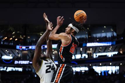 Mar 18, 2023; Sacramento, CA, USA; Princeton Tigers forward Tosan Evbuomwan (20) attempts a pass while defended by Missouri Tigers guard Kobe Brown (24) during the second half at Golden 1 Center. Mandatory Credit: Kelley L Cox-USA TODAY Sports