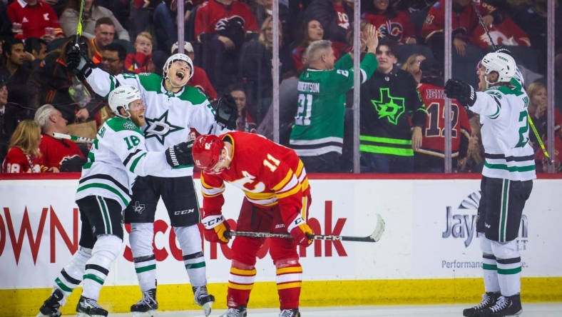 Mar 18, 2023; Calgary, Alberta, CAN; Dallas Stars left wing Jason Robertson (21) celebrates his goal with teammates against the Calgary Flames during the overtime period at Scotiabank Saddledome. Mandatory Credit: Sergei Belski-USA TODAY Sports
