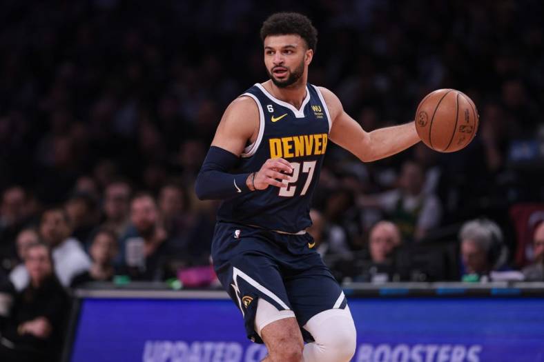 Mar 19, 2023; Brooklyn, New York, USA; Denver Nuggets guard Jamal Murray (27) dribbles during the first half against the Brooklyn Nets at Barclays Center. Mandatory Credit: Vincent Carchietta-USA TODAY Sports