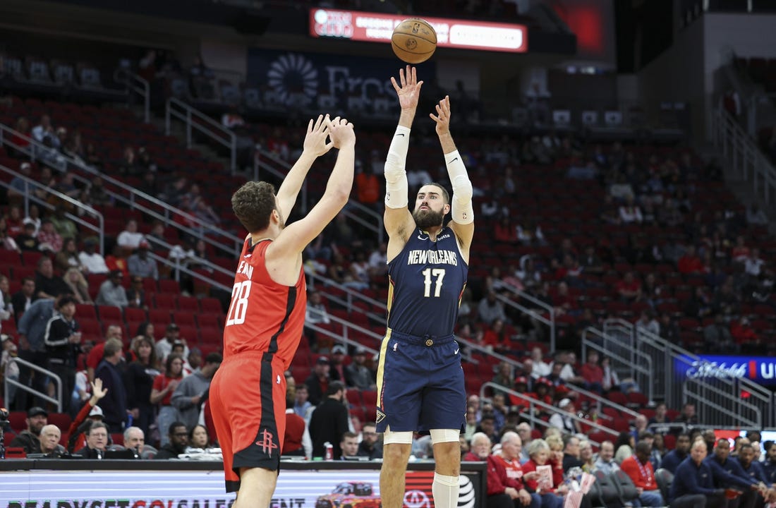 Mar 19, 2023; Houston, Texas, USA; New Orleans Pelicans center Jonas Valanciunas (17) shoots the ball over Houston Rockets center Alperen Sengun (28) during the first quarter at Toyota Center. Mandatory Credit: Troy Taormina-USA TODAY Sports