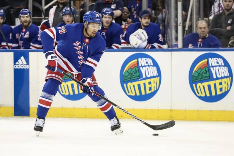 Mar 19, 2023; New York, New York, USA;  New York Rangers defenseman K'Andre Miller (79) controls the puck in the second period against the Nashville Predators at Madison Square Garden. Mandatory Credit: Wendell Cruz-USA TODAY Sports