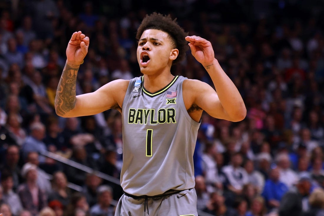 Mar 19, 2023; Denver, CO, USA; Baylor Bears guard Keyonte George (1) reacts in the second half against the Creighton Bluejays at Ball Arena. Mandatory Credit: Michael Ciaglo-USA TODAY Sports