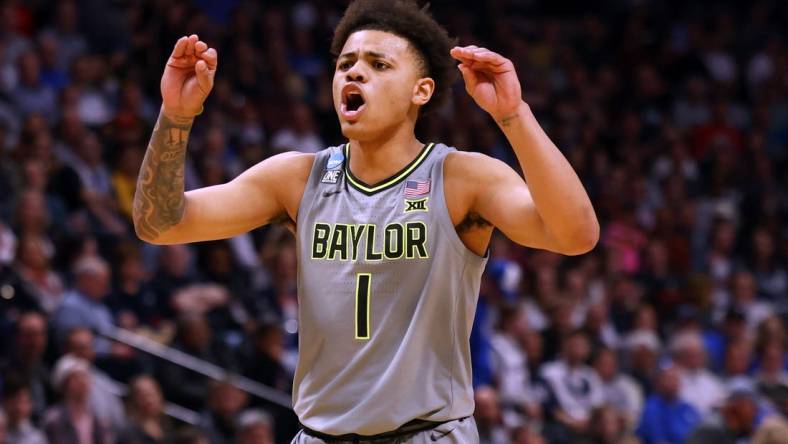 Mar 19, 2023; Denver, CO, USA; Baylor Bears guard Keyonte George (1) reacts in the second half against the Creighton Bluejays at Ball Arena. Mandatory Credit: Michael Ciaglo-USA TODAY Sports