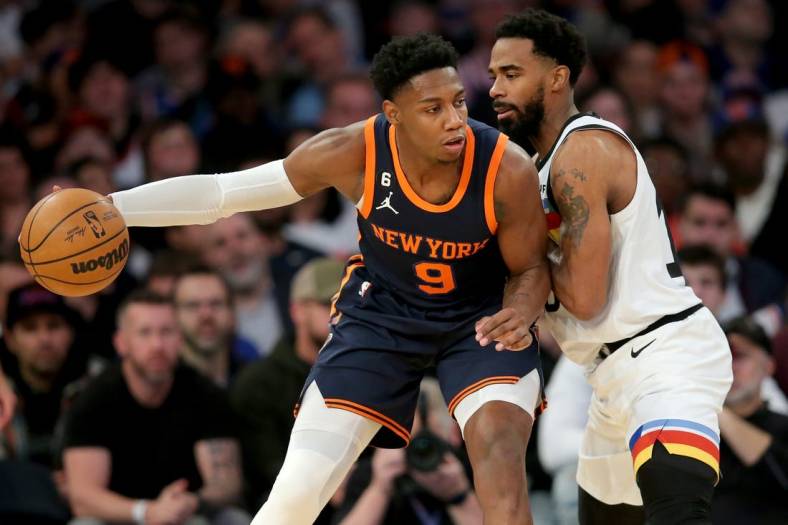 Mar 20, 2023; New York, New York, USA; New York Knicks guard RJ Barrett (9) controls the ball against Minnesota Timberwolves guard Mike Conley (10) during the second quarter at Madison Square Garden. Mandatory Credit: Brad Penner-USA TODAY Sports