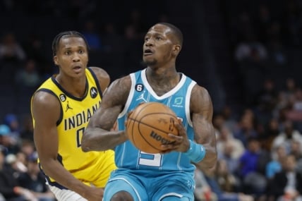 Mar 20, 2023; Charlotte, North Carolina, USA; Charlotte Hornets guard Terry Rozier (3) looks to shoot ahead of Indiana Pacers guard Bennedict Mathurin (00) during the second half at Spectrum Center. The Charlotte Hornets won 115-109. Mandatory Credit: Nell Redmond-USA TODAY Sports