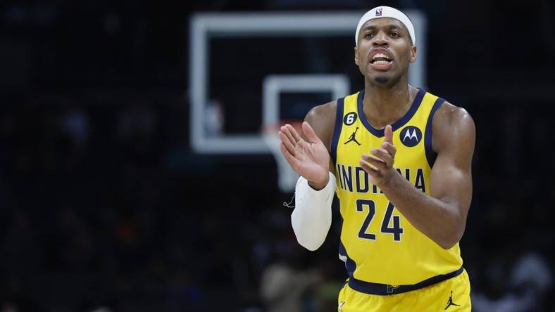 Mar 20, 2023; Charlotte, North Carolina, USA; Indiana Pacers guard Buddy Hield (24) encourages his team as they play against the Charlotte Hornets during the second half at Spectrum Center. Mandatory Credit: Nell Redmond-USA TODAY Sports