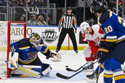 Mar 21, 2023; St. Louis, Missouri, USA;  Detroit Red Wings right wing Alex Chiasson (48) scores against St. Louis Blues goaltender Joel Hofer (30) during the first period at Enterprise Center. Mandatory Credit: Jeff Curry-USA TODAY Sports