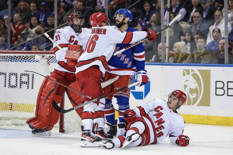 Mar 21, 2023; New York, New York, USA;  Carolina Hurricanes left wing Teuvo Teravainen (86) and New York Rangers center Vincent Trocheck (16) shove each other in the third period at Madison Square Garden. Mandatory Credit: Wendell Cruz-USA TODAY Sports