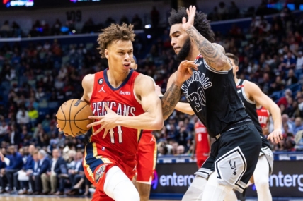 Mar 21, 2023; New Orleans, Louisiana, USA; New Orleans Pelicans guard Dyson Daniels (11) dribbles against San Antonio Spurs forward Julian Champagnie (30)  during the second half at Smoothie King Center. Mandatory Credit: Stephen Lew-USA TODAY Sports