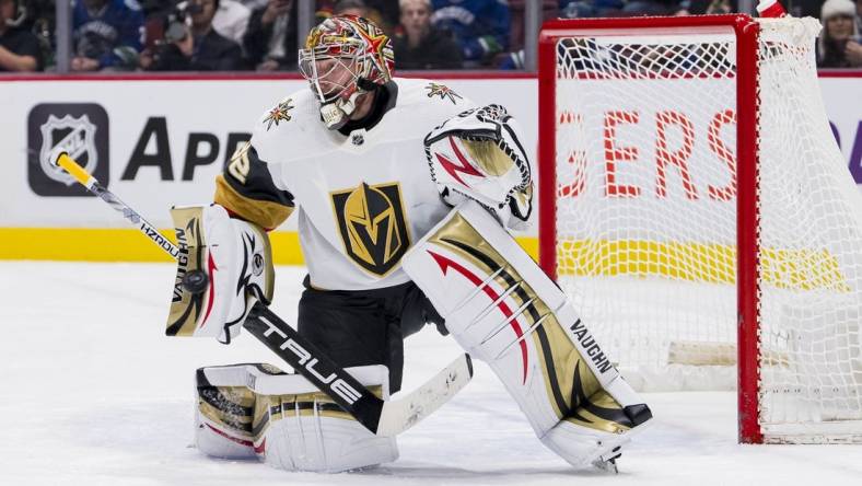 Mar 21, 2023; Vancouver, British Columbia, CAN; Vegas Golden Knights goaltender Jonathan Quick (32) makes a save against the Vancouver Canucks in the third period at Rogers Arena. Mandatory Credit: Bob Frid-USA TODAY Sports