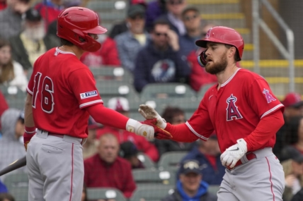 Mar 22, 2023; Salt River Pima-Maricopa, Arizona, USA; Los Angeles Angels first baseman Jared Walsh (20) celebrates after hitting a solo home run against the Colorado Rockies with center fielder Mickey Moniak (16) in the second inning at Salt River Fields at Talking Stick. Mandatory Credit: Rick Scuteri-USA TODAY Sports