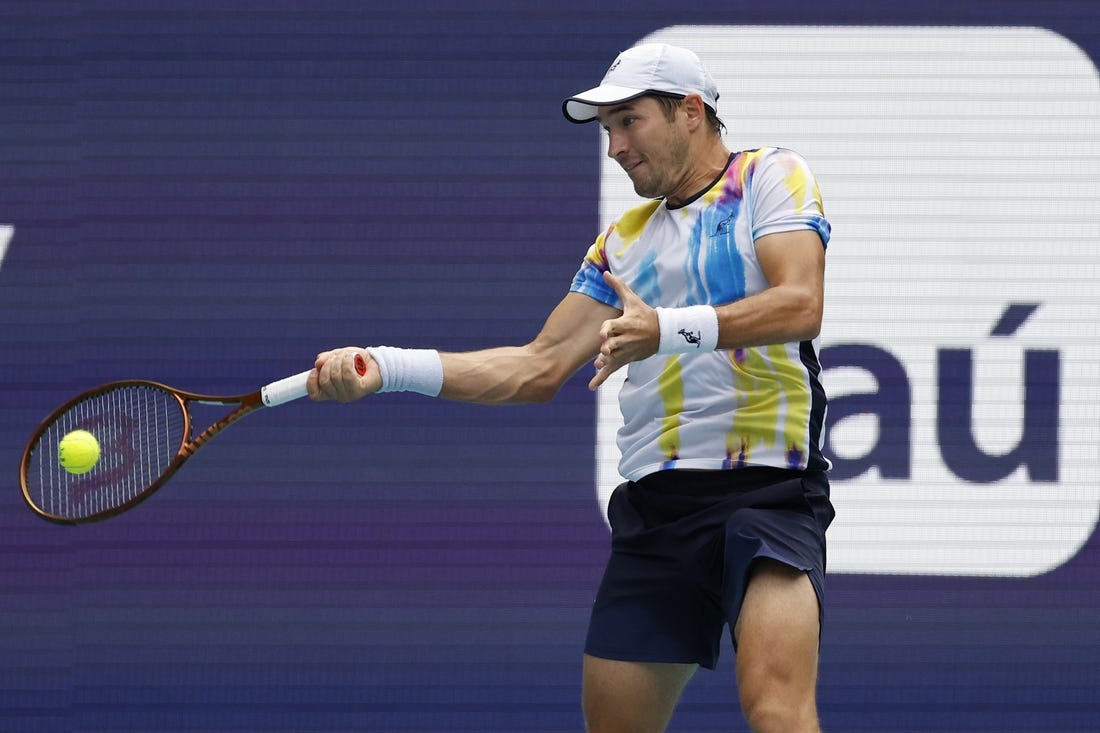 Mar 22, 2023; Miami, Florida, US; Dusan Lajovic (SRB) hits a forehand against Andy Murray (GBR) (not pictured) on day three of the Miami Open at Hard Rock Stadium. Mandatory Credit: Geoff Burke-USA TODAY Sports