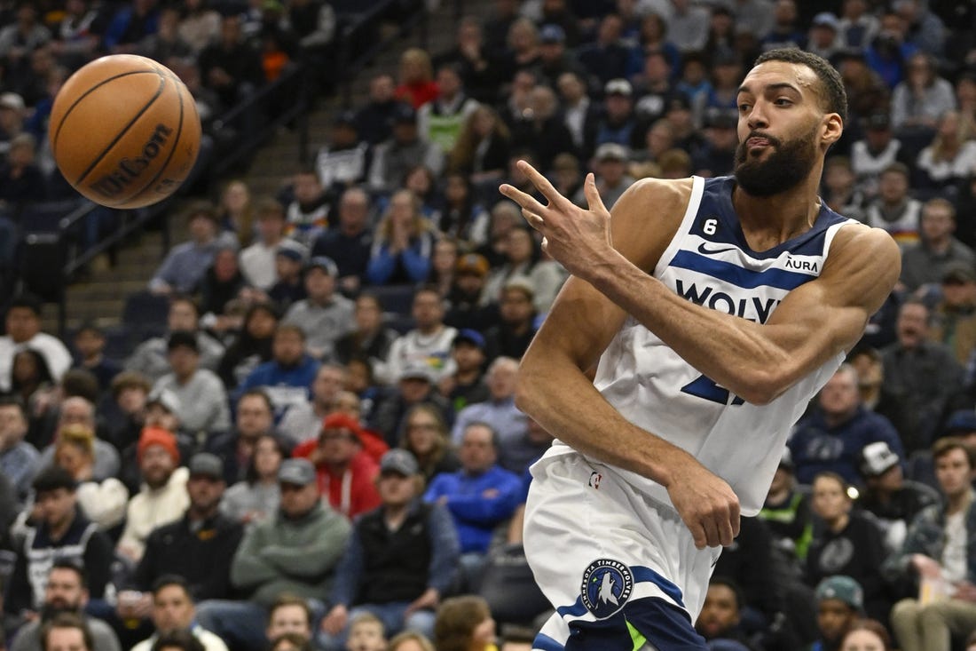 Mar 22, 2023; Minneapolis, Minnesota, USA;  Minnesota Timberwolves center Rudy Gobert (27) saves the ball from going out of bounds against the Atlanta Hawks in the second quarter at Target Center. Mandatory Credit: Nick Wosika-USA TODAY Sports