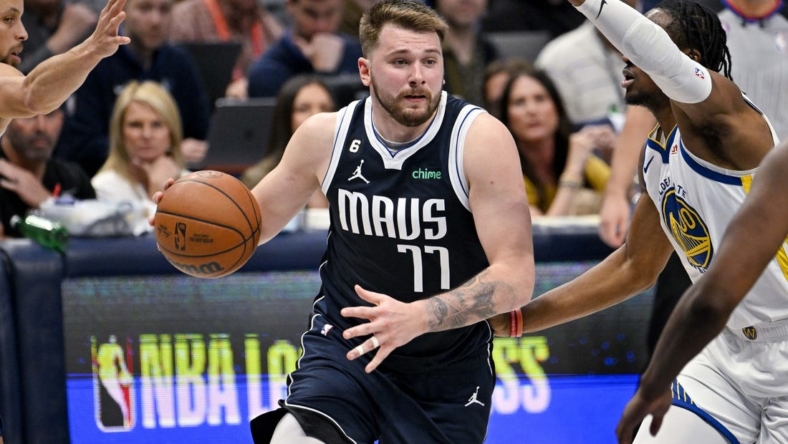 Mar 22, 2023; Dallas, Texas, USA; Dallas Mavericks guard Luka Doncic (77) drives to the basket against the Golden State Warriors during the second half at the American Airlines Center. Mandatory Credit: Jerome Miron-USA TODAY Sports
