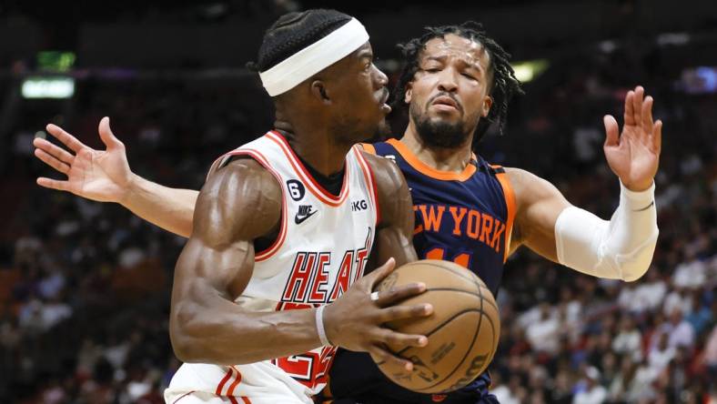 Mar 22, 2023; Miami, Florida, USA; Miami Heat forward Jimmy Butler (22) drives to the basket against New York Knicks guard Jalen Brunson (11) during the third quarter at Miami-Dade Arena. Mandatory Credit: Sam Navarro-USA TODAY Sports