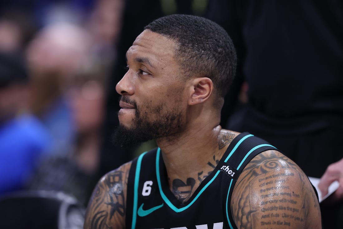 Mar 22, 2023; Salt Lake City, Utah, USA; Portland Trail Blazers guard Damian Lillard (0) looks on during a time out against the Utah Jazz in the third quarter at Vivint Arena. Mandatory Credit: Rob Gray-USA TODAY Sports