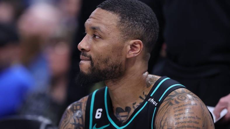 Mar 22, 2023; Salt Lake City, Utah, USA; Portland Trail Blazers guard Damian Lillard (0) looks on during a time out against the Utah Jazz in the third quarter at Vivint Arena. Mandatory Credit: Rob Gray-USA TODAY Sports