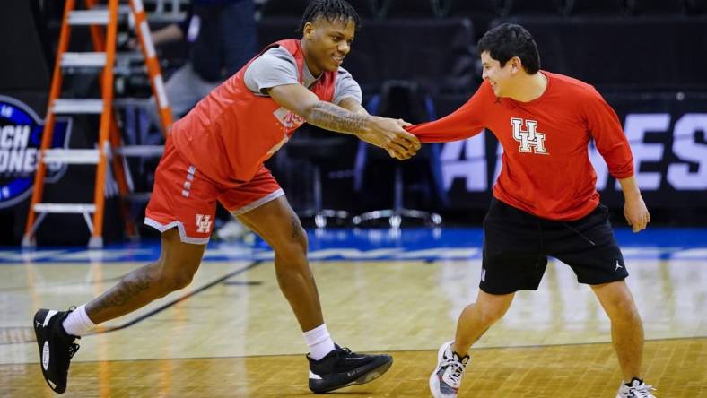 Mar 23, 2023; Kansas City, MO, USA; Houston Cougars guard Marcus Sasser (0) grabs a team trainer during a practice session at T-Mobile Center. Mandatory Credit: Jay Biggerstaff-USA TODAY Sports