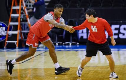 Mar 23, 2023; Kansas City, MO, USA; Houston Cougars guard Marcus Sasser (0) grabs a team trainer during a practice session at T-Mobile Center. Mandatory Credit: Jay Biggerstaff-USA TODAY Sports