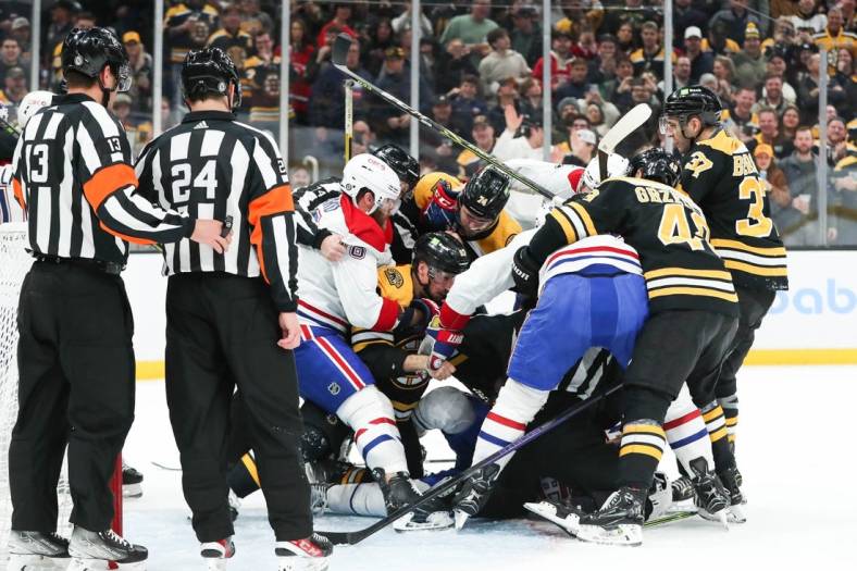 Mar 23, 2023; Boston, Massachusetts, USA; The Boston Bruins and Montreal Canadiens fight during a game at TD Garden. Mandatory Credit: Paul Rutherford-USA TODAY Sports