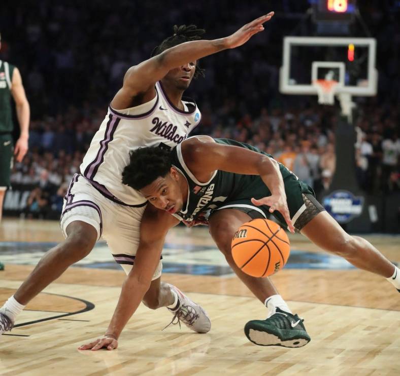Michigan State guard A.J. Hoggard drives against Kansas State guard Cam Carter during the second half of MSU's 98-93 overtime loss in the Sweet 16 on Thursday, March 23, 2023, in New York.

Msuku 032323 Kd6396
