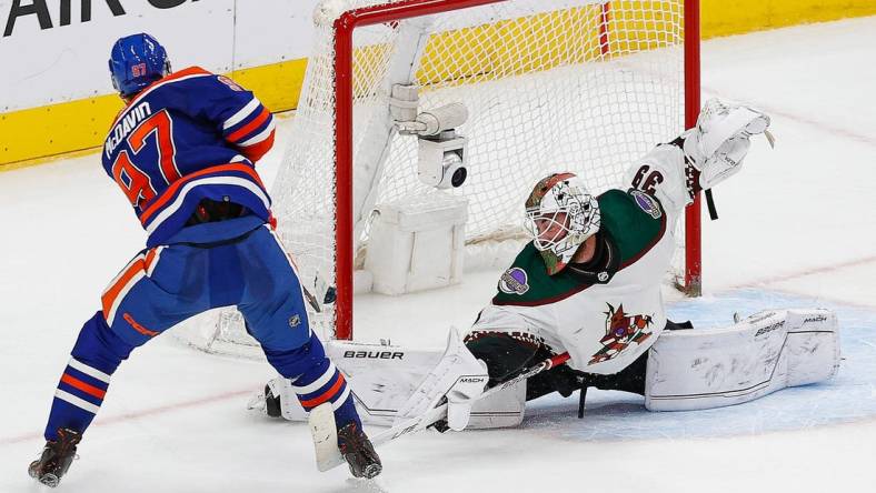 Mar 22, 2023; Edmonton, Alberta, CAN; Arizona Coyotes goaltender Connor Ingram (39) makes a save on Edmonton Oilers forward Connor McDavid (97) during overtime at Rogers Place. Mandatory Credit: Perry Nelson-USA TODAY Sports