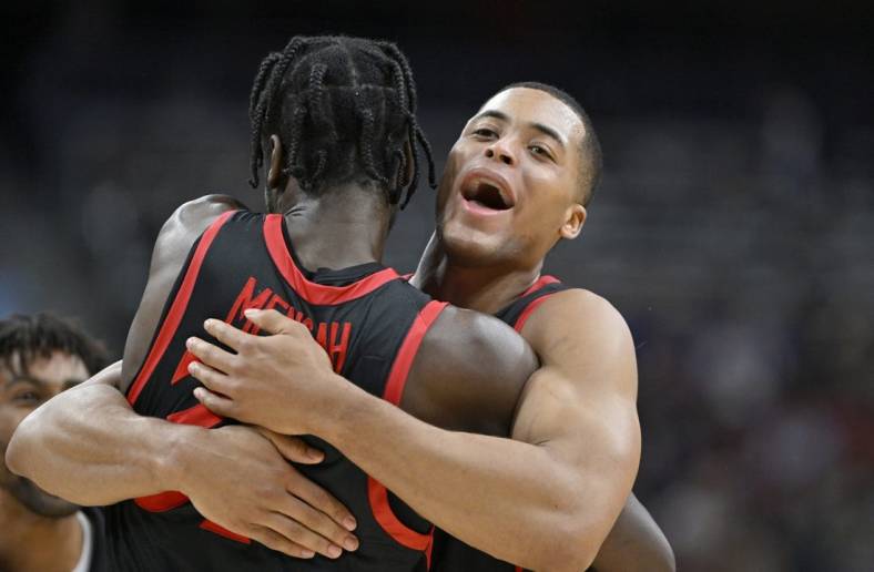 Mar 24, 2023; Louisville, KY, USA; San Diego State Aztecs forward Jaedon LeDee (13) hugs San Diego State Aztecs forward Nathan Mensah (31) during the second half of the NCAA tournament round of sixteen against the Alabama Crimson Tide at KFC YUM! Center. Mandatory Credit: Jamie Rhodes-USA TODAY Sports