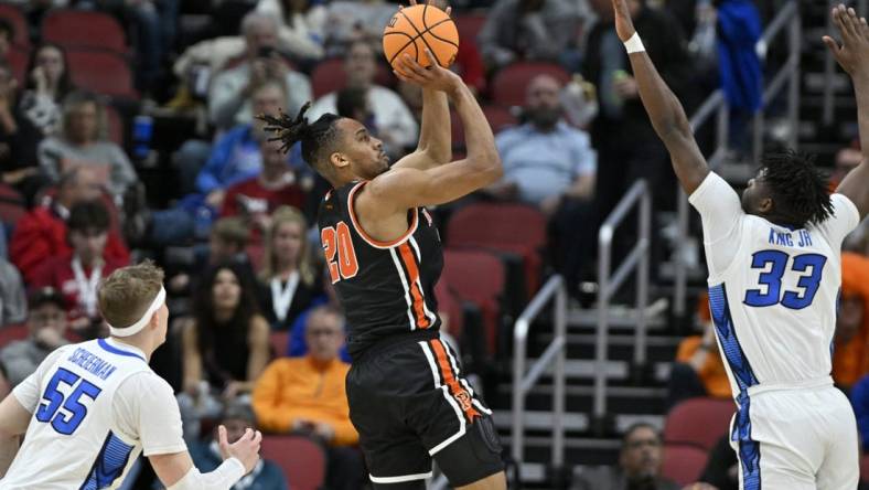 Mar 24, 2023; Louisville, KY, USA; Princeton Tigers forward Tosan Evbuomwan (20) shoots over Creighton Bluejays center Fredrick King (33) during the first half of the NCAA tournament round of sixteen at KFC YUM! Center. Mandatory Credit: Jamie Rhodes-USA TODAY Sports