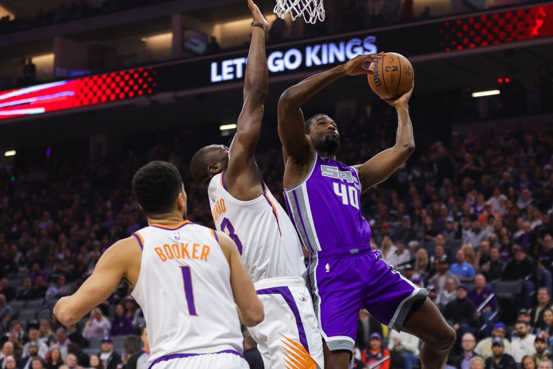 Mar 24, 2023; Sacramento, California, USA; Sacramento Kings forward Harrison Barnes (40) drives to the basket against Phoenix Suns center Bismack Biyombo (18) during the first quarter at Golden 1 Center. Mandatory Credit: Sergio Estrada-USA TODAY Sports