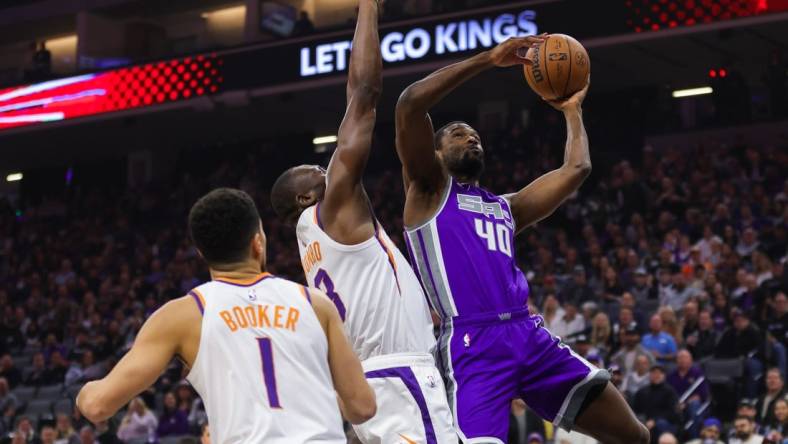 Mar 24, 2023; Sacramento, California, USA; Sacramento Kings forward Harrison Barnes (40) drives to the basket against Phoenix Suns center Bismack Biyombo (18) during the first quarter at Golden 1 Center. Mandatory Credit: Sergio Estrada-USA TODAY Sports