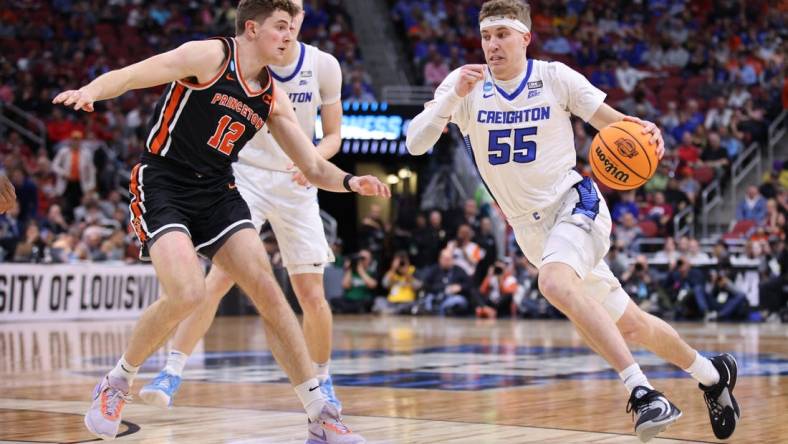 Mar 24, 2023; Louisville, KY, USA; Creighton Bluejays guard Baylor Scheierman (55) drives against Princeton Tigers forward Caden Pierce (12) during the second half of the NCAA tournament round of sixteen at KFC YUM! Center. Mandatory Credit: Jordan Prather-USA TODAY Sports