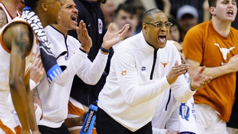 Mar 24, 2023; Kansas City, MO, USA; Texas Longhorns head coach Rodney Terry cheers from the bench during the first half of an NCAA tournament Midwest Regional semifinal against the Xavier Musketeers at T-Mobile Center. Mandatory Credit: Jay Biggerstaff-USA TODAY Sports